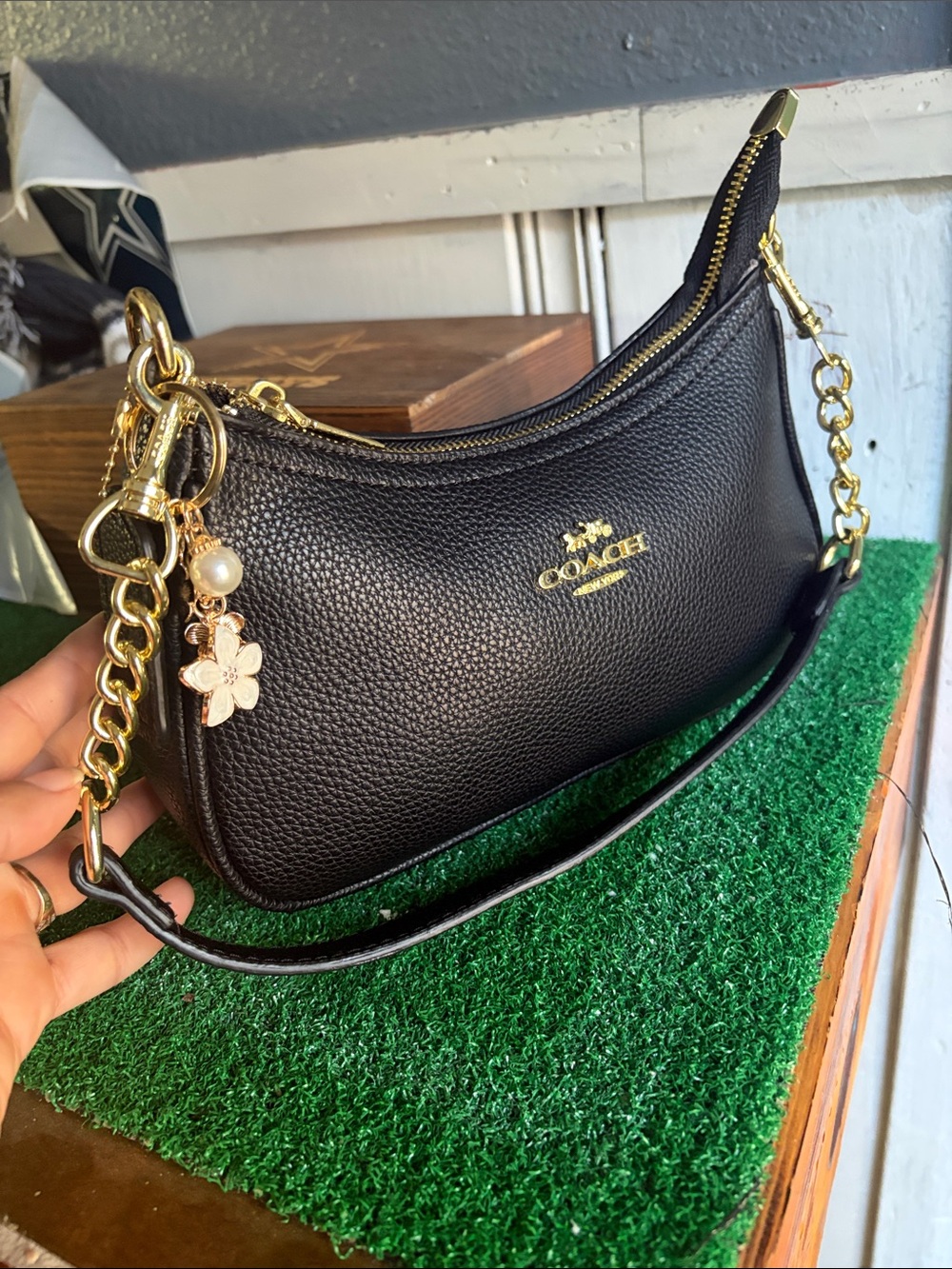 COACH Black Pebbled Leather Shoulder Bag with Gold Hardware and Charm
